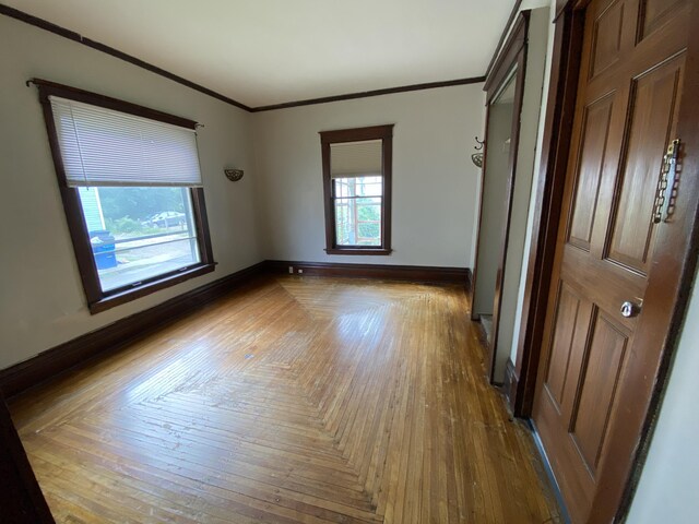 925 W Lovell St, Kalamazoo, MI 49007 - spare room with baseboards and crown molding