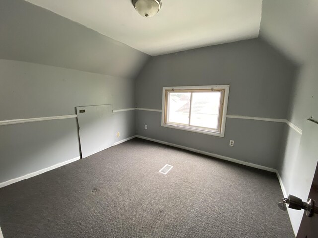 925 W Lovell St, Kalamazoo, MI 49007 - bonus room featuring vaulted ceiling, carpet flooring, and baseboards