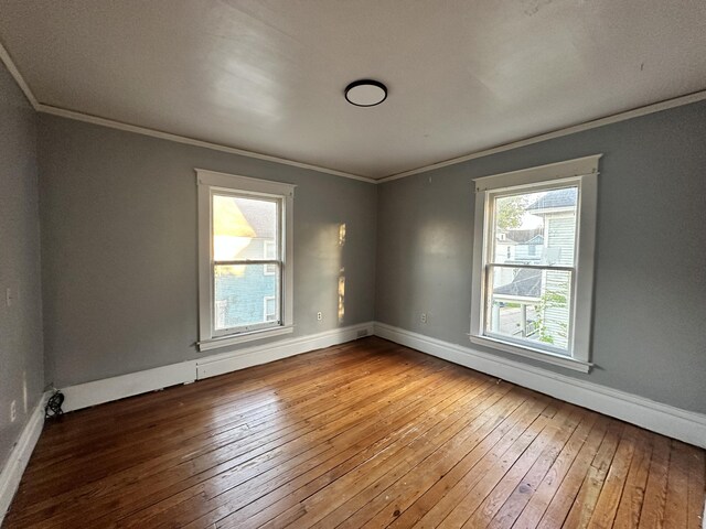 925 W Lovell St, Kalamazoo, MI 49007 - empty room with wood-type flooring, crown molding, and baseboards