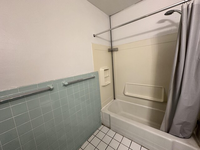 925 W Lovell St, Kalamazoo, MI 49007 - full bathroom with shower / tub combo with curtain, tile patterned floors, wainscoting, and tile walls