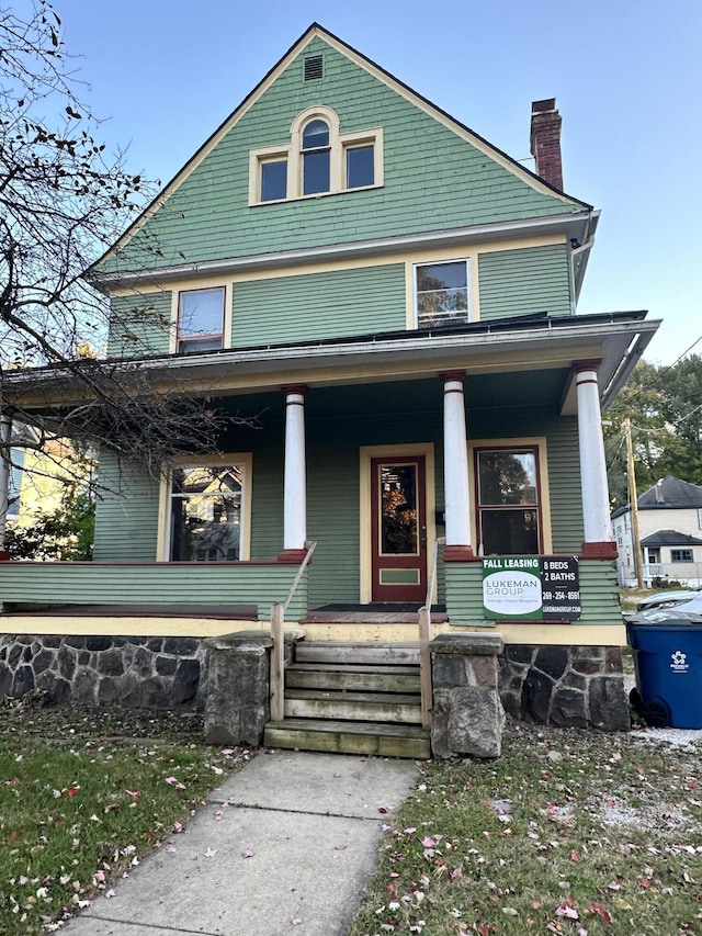 925 W Lovell St, Kalamazoo, MI 49007 - view of front of property with covered porch and a chimney
