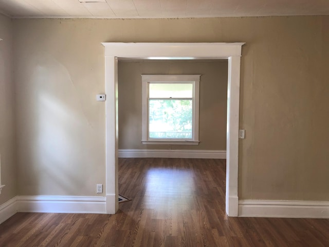 hallway featuring dark wood-type flooring