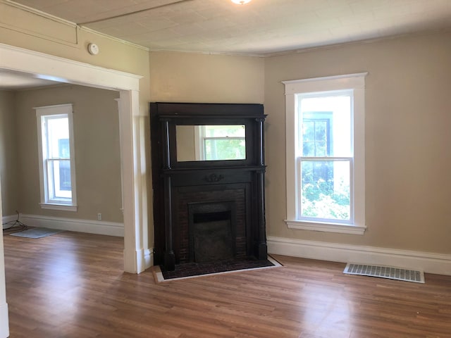 interior space with crown molding and hardwood / wood-style flooring