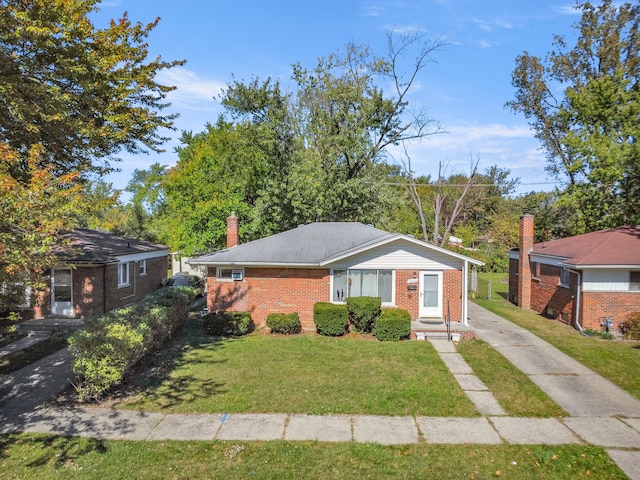 ranch-style house with a front lawn