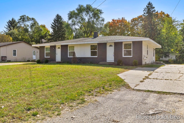 ranch-style house with a front lawn