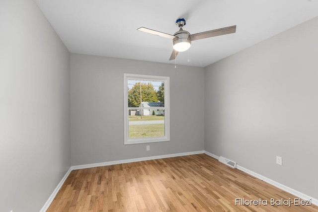 unfurnished room featuring ceiling fan and light wood-type flooring