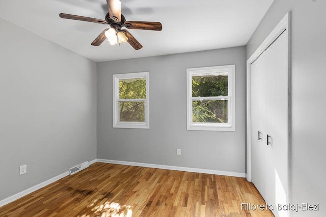 unfurnished room featuring wood-type flooring and ceiling fan