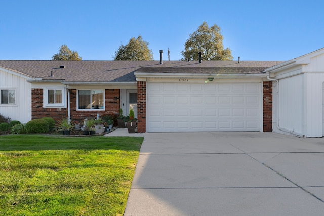 ranch-style house with a garage and a front lawn