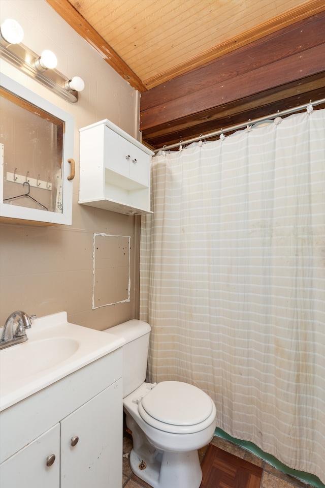 bathroom with parquet flooring, toilet, wooden ceiling, vanity, and beam ceiling