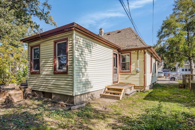 view of home's exterior featuring a lawn