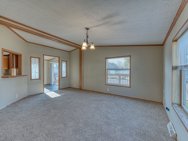 spare room with light carpet, a textured ceiling, an inviting chandelier, and vaulted ceiling