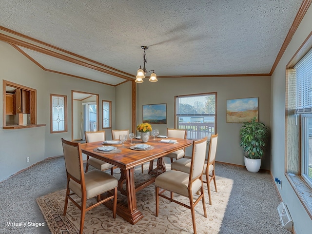 dining room featuring a textured ceiling, light colored carpet, and lofted ceiling