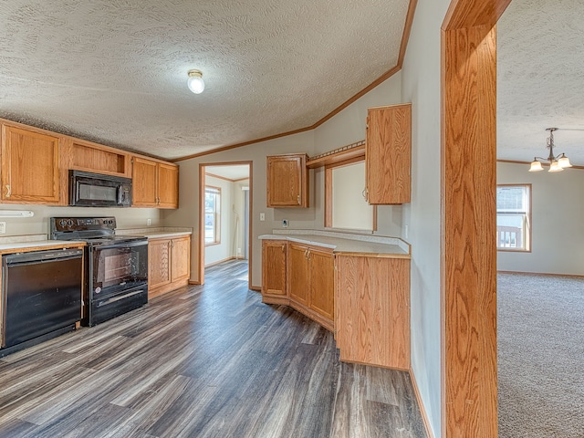 kitchen with black appliances, dark hardwood / wood-style flooring, lofted ceiling, and a textured ceiling