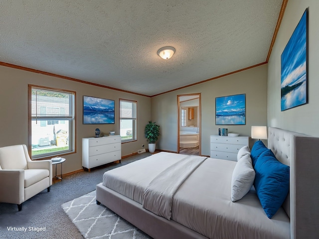 bedroom with carpet, ensuite bathroom, a textured ceiling, and multiple windows