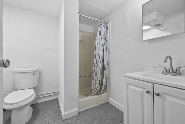 bathroom with vanity, toilet, and walk in shower