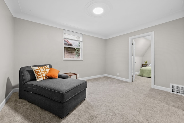 living area with light carpet