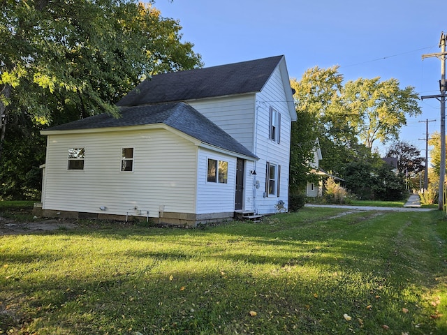 99 S Western Ave, Grant, MI 49327 - view of home's exterior with a lawn and a shingled roof