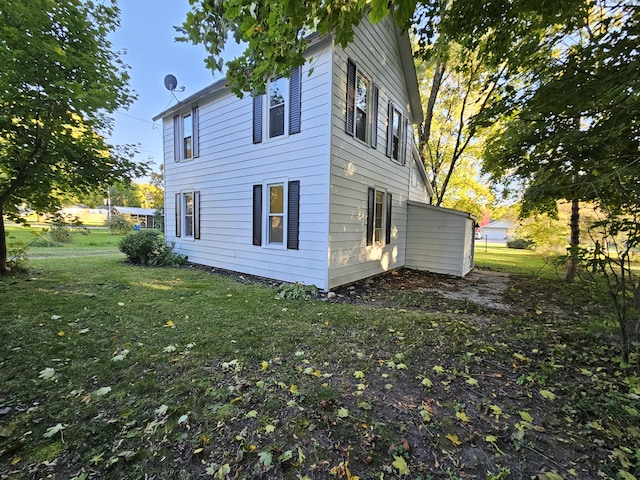 99 S Western Ave, Grant, MI 49327 - view of side of home with a lawn