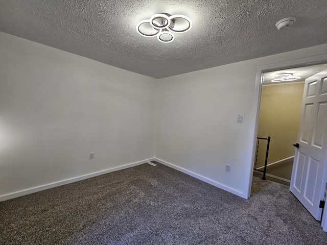 99 S Western Ave, Grant, MI 49327 - carpeted empty room featuring a smoke detector, baseboards, and a textured ceiling