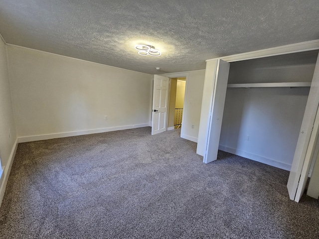 99 S Western Ave, Grant, MI 49327 - unfurnished bedroom featuring carpet floors, a textured ceiling, a closet, and baseboards