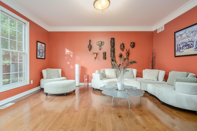 living room featuring crown molding and hardwood / wood-style floors