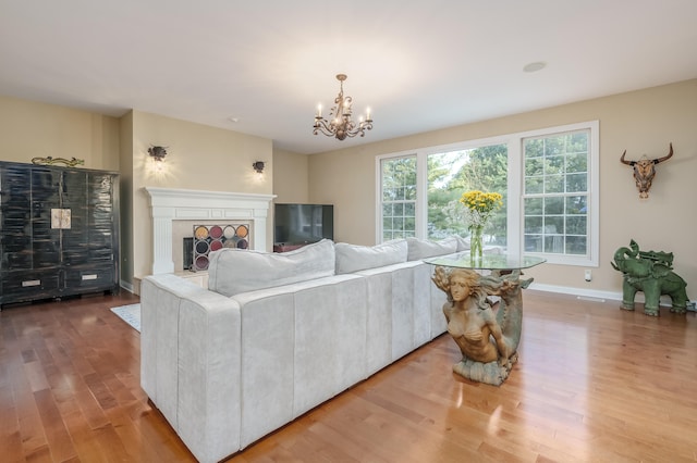 living room featuring hardwood / wood-style floors and an inviting chandelier