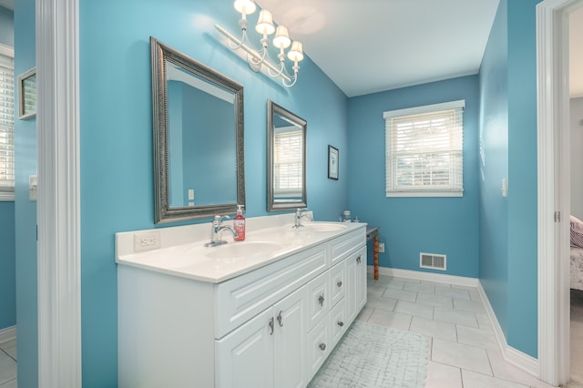 bathroom featuring tile patterned flooring and vanity