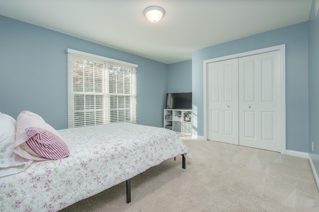 carpeted bedroom with a closet