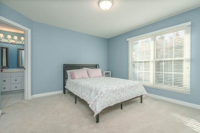 bedroom with light colored carpet