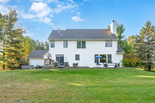 back of property with central air condition unit, a patio area, a yard, and a hot tub