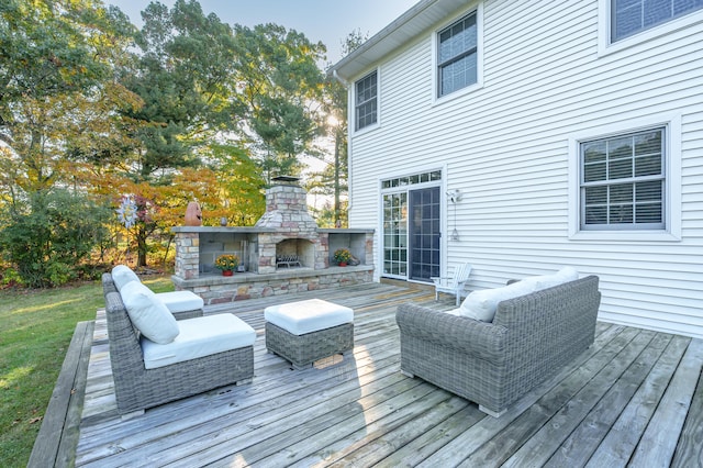 deck featuring an outdoor stone fireplace