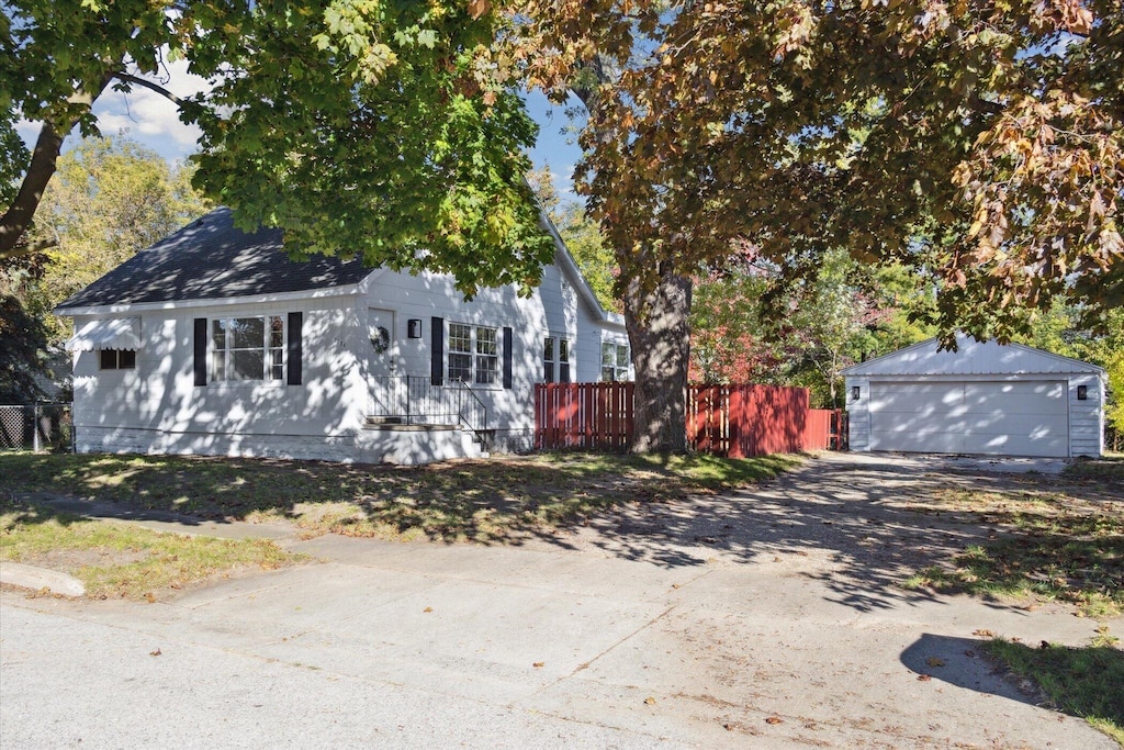 view of front of property with an outbuilding and a garage