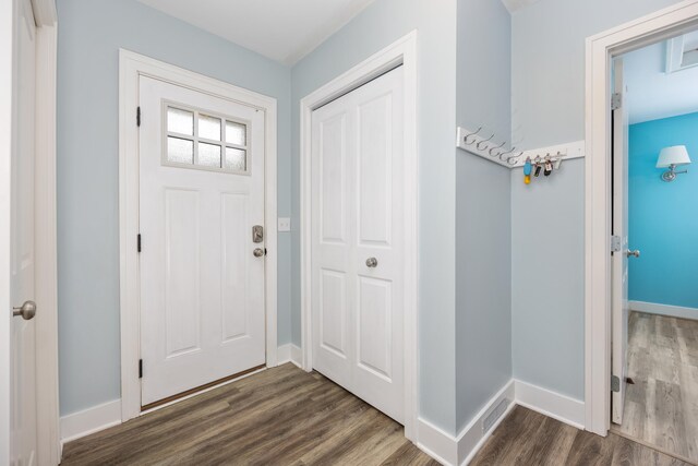 entryway with dark hardwood / wood-style flooring