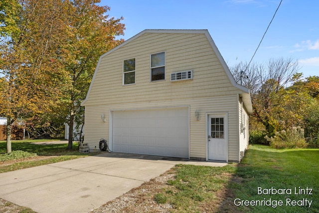 garage featuring a lawn