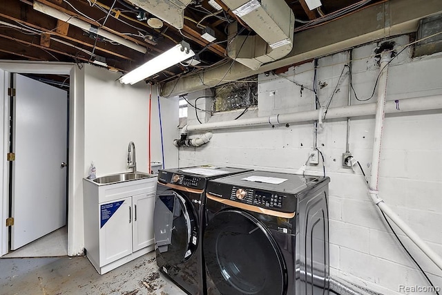 laundry room featuring independent washer and dryer and sink