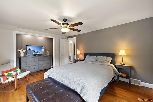 bedroom featuring wood-type flooring and ceiling fan