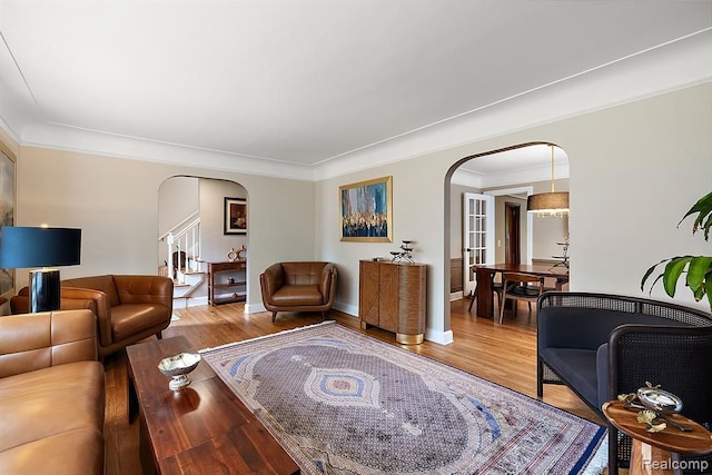 living room featuring ornamental molding and hardwood / wood-style flooring