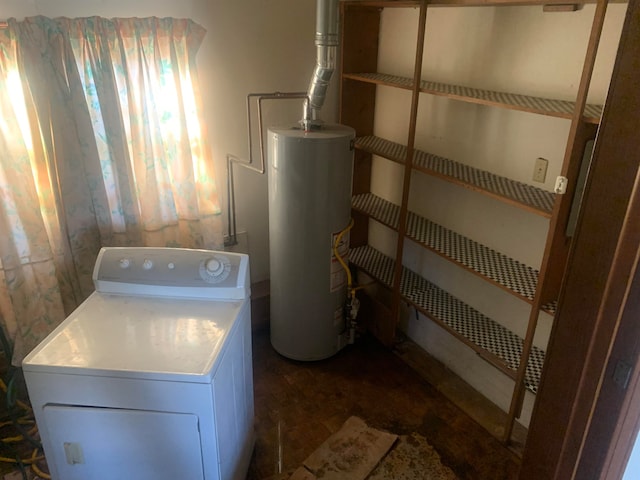 laundry room featuring gas water heater and washer / dryer