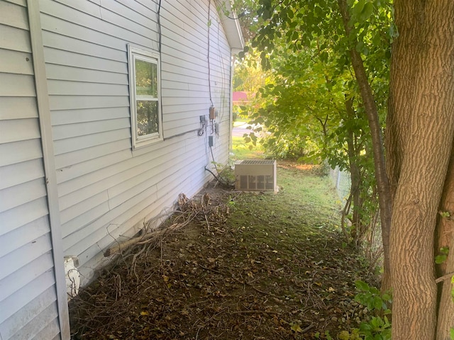 view of home's exterior with central AC