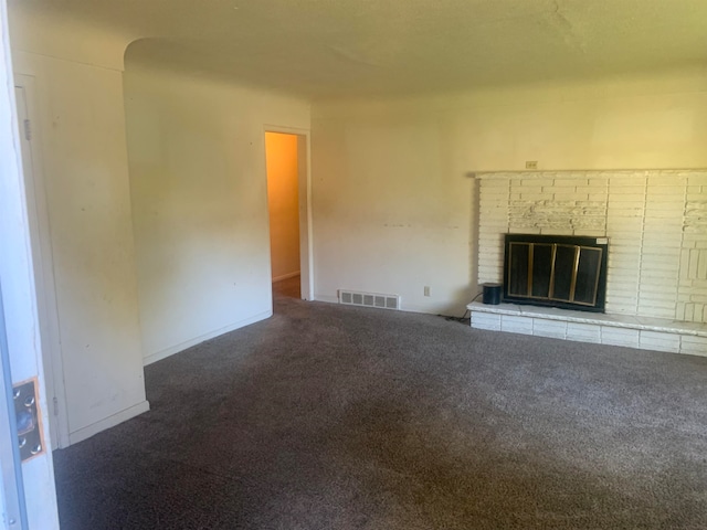 unfurnished living room with carpet floors