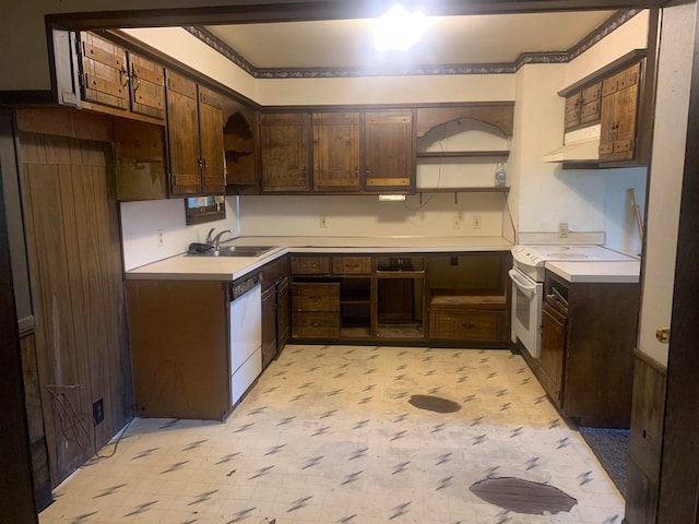 kitchen featuring dark brown cabinetry, white appliances, and sink