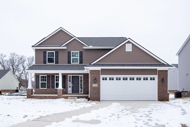 view of front of property with an attached garage, roof with shingles, a porch, and brick siding