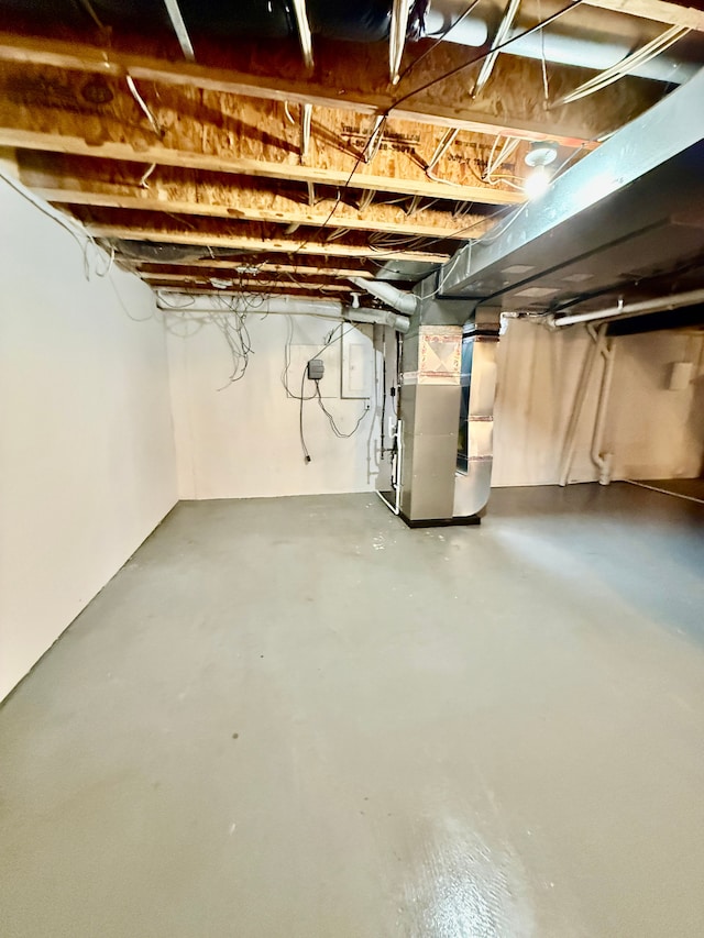 basement featuring heating unit