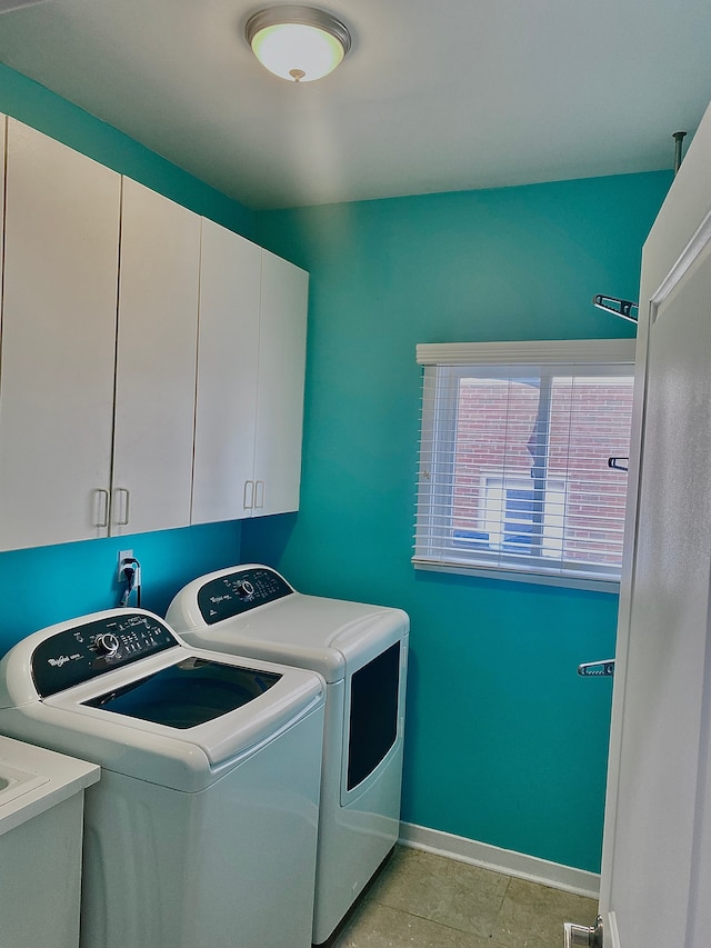 laundry area with cabinets, sink, and independent washer and dryer