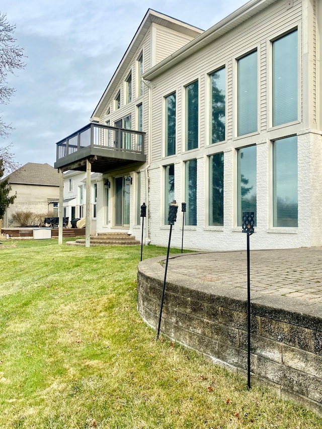 rear view of property featuring a yard