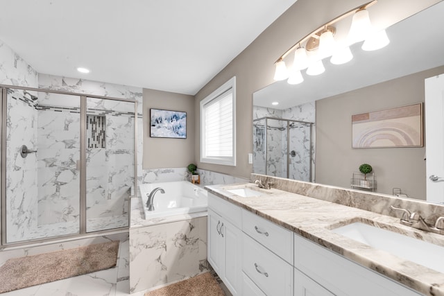 full bath featuring a garden tub, a sink, a marble finish shower, and double vanity