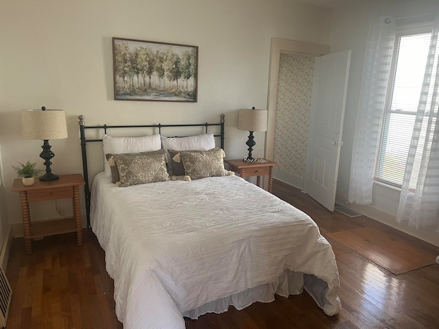 bedroom featuring dark hardwood / wood-style floors