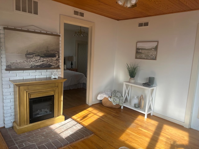 interior space with hardwood / wood-style flooring and wooden ceiling