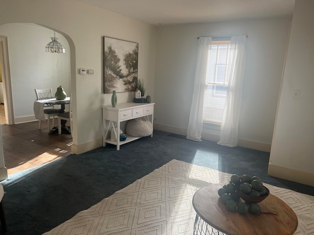 interior space featuring dark colored carpet