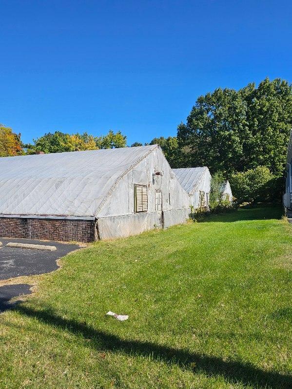 view of home's exterior with a yard